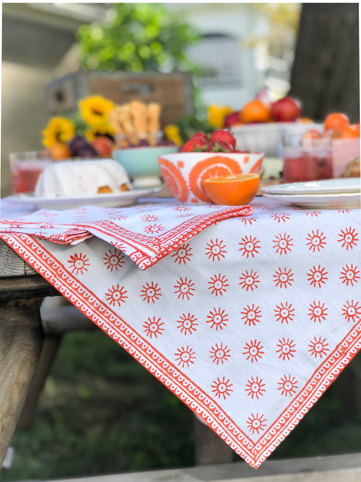 Here Comes the Sun Tablecloth in Cardinal Red